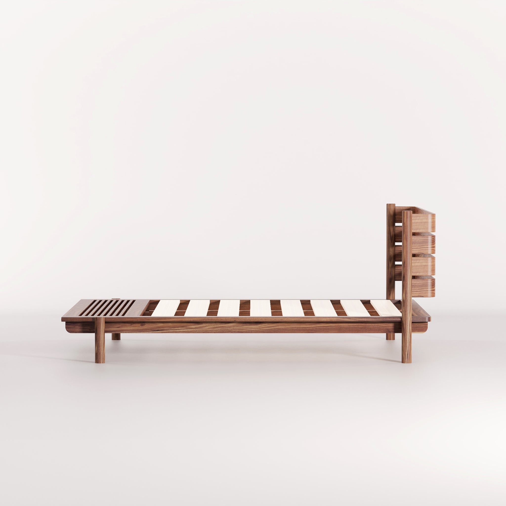A modern, Australian made, timber bed with a headboard and bench seat.